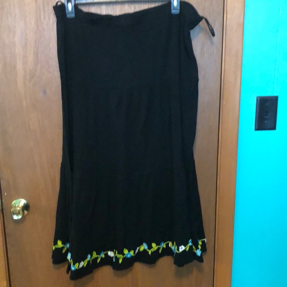 Boho L tiered skirt with floral embroidery hem.
